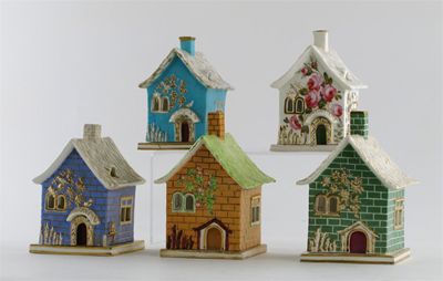 Appraisal: Five English porcelain pastille burners and covers modelled as cottages