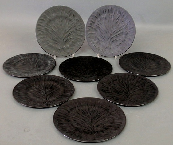 Appraisal: Set of eight black glass Art Nouveau tree motif plates