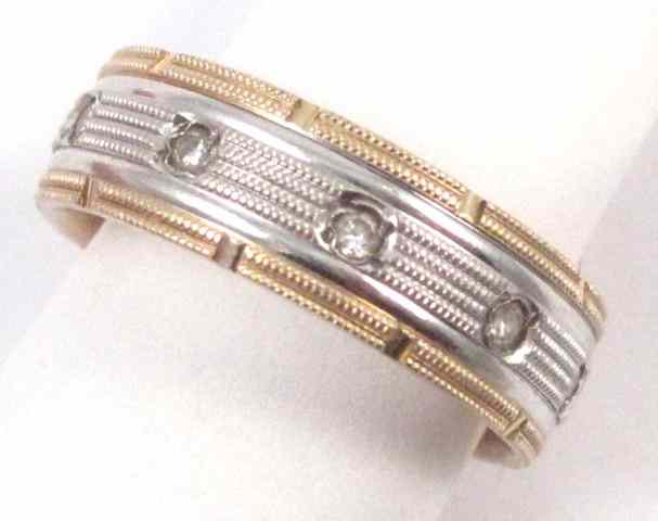 Appraisal: MAN'S DIAMOND AND FOURTEEN KARAT GOLD RING set with ten