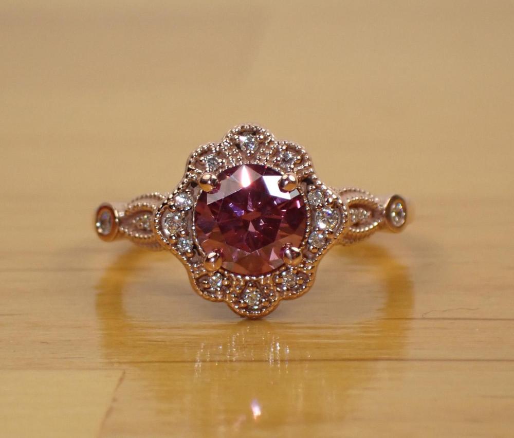 Appraisal: PINK DIAMOND WHITE DIAMONDS AND FOURTEEN KARAT ROSE GOLD RING