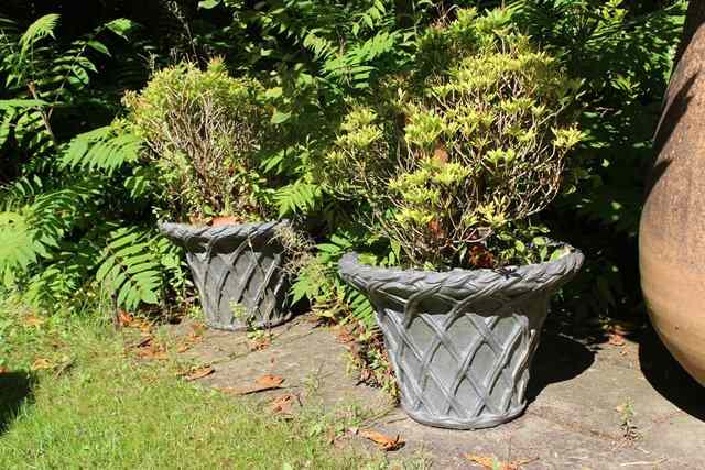 Appraisal: A SET OF SIX COMPOSITE PLANTERS of tapering form with