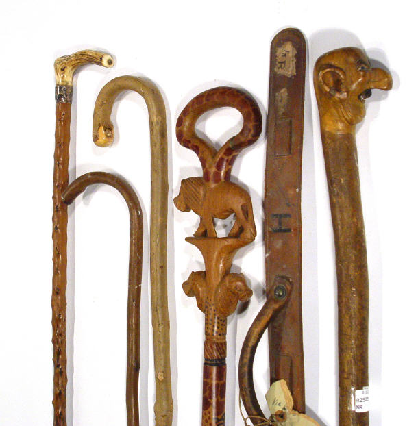 Appraisal: Collection of walking canes including a novelty figural cane tribal