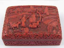 Appraisal: A Chinese red lacquer box with blue glazed interior the