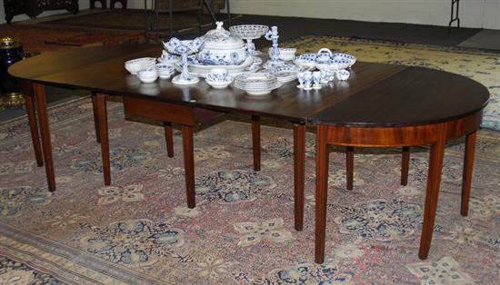 Appraisal: CHIPPENDALE FIGURED MAHOGANY THREE PART DINING TABLE th century with