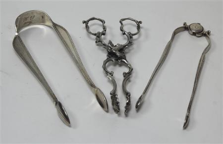 Appraisal: A pair of cast silver novelty sugar tongs in the