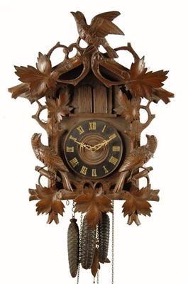 Appraisal: A Black Forest carved and stained wood cuckoo clock with