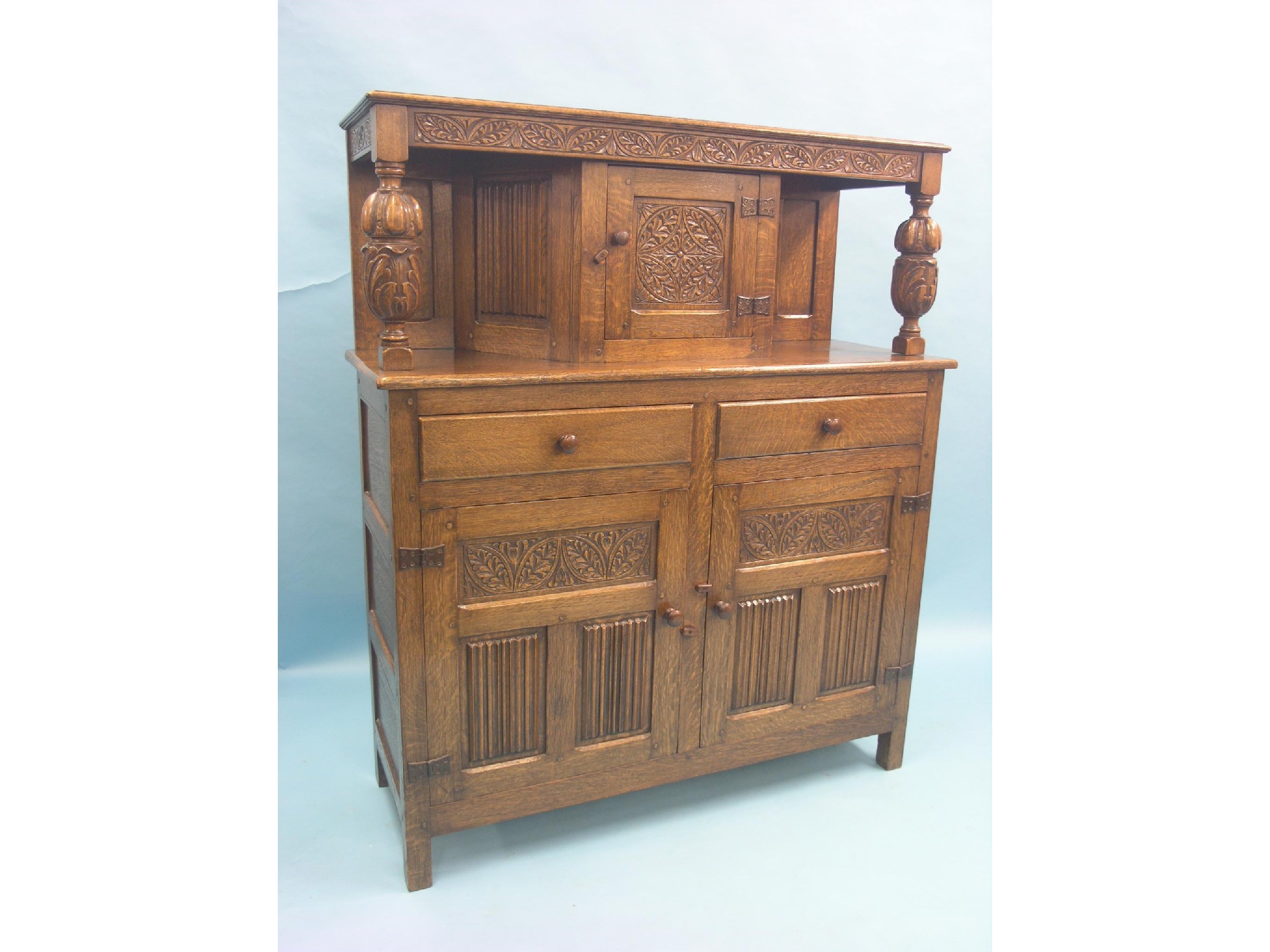 Appraisal: A solid medium oak court cupboard angular cupboard above pair