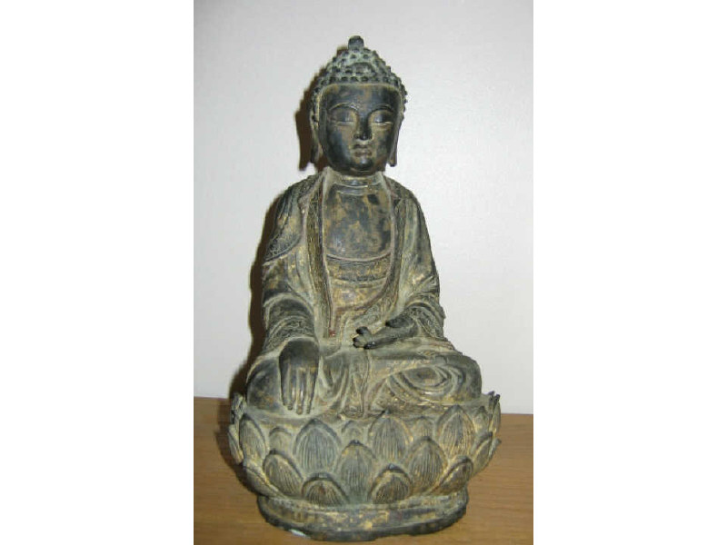 Appraisal: ANTIQUE CHINESE BRONZE BUDDHA Seated figure with crossed legs having