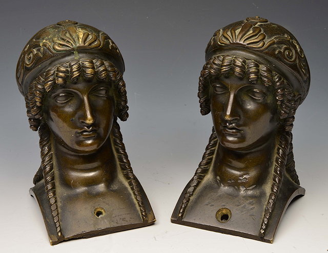 Appraisal: A PAIR OF EGYPTIAN REVIVAL BRONZE CLASSICAL FIGURE HEADS on