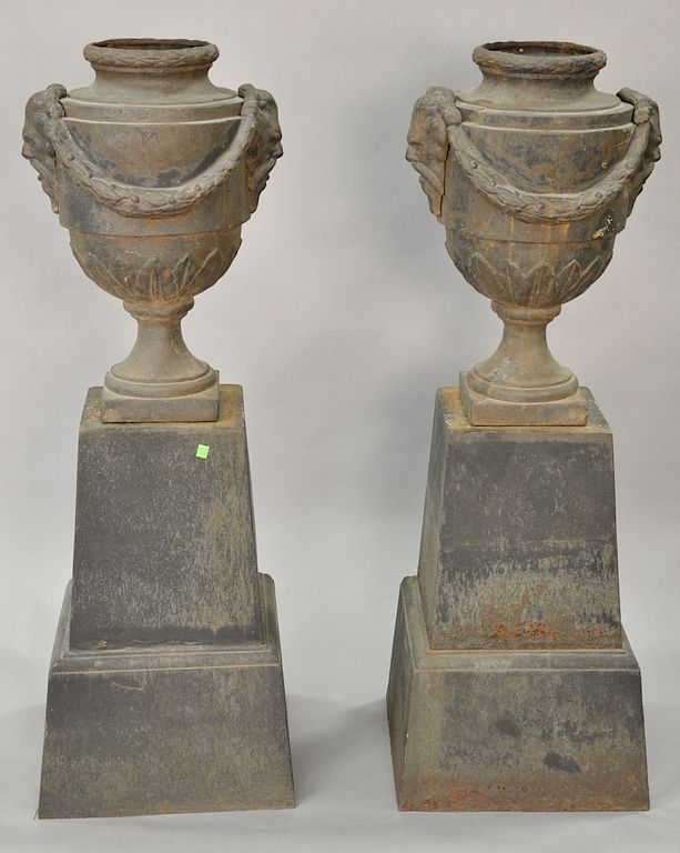 Appraisal: Pair of large iron outdoor urns on bases total height