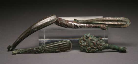 Appraisal: FIVE ARCHAIC BRONZE BUCKLES Group of five archaic Chinese bronze