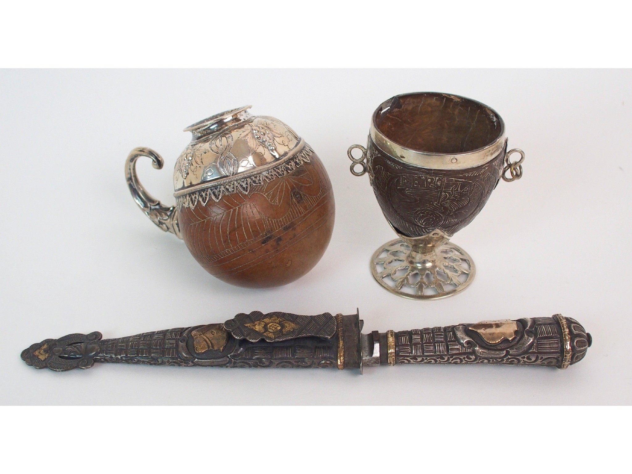 Appraisal: A th Century white metal mounted gourd wine cupthe gourd