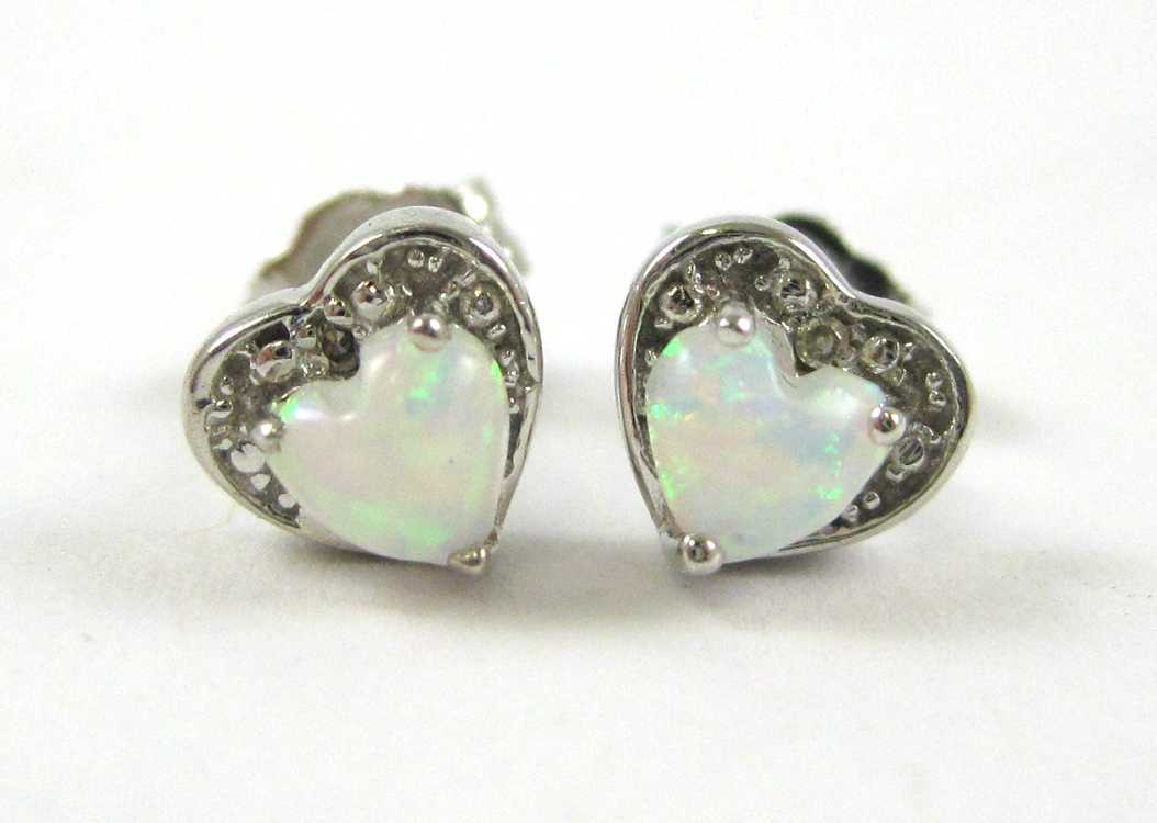 Appraisal: PAIR OF OPAL AND DIAMOND STUD EARRINGS each k white