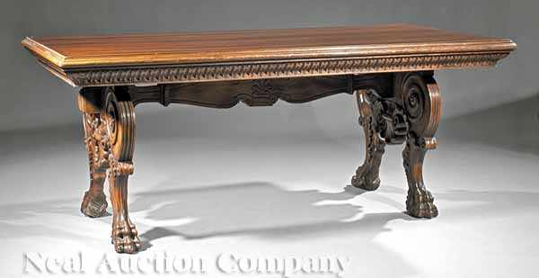 Appraisal: A Renaissance-Style Carved Walnut Library Table molded top dentilated skirt