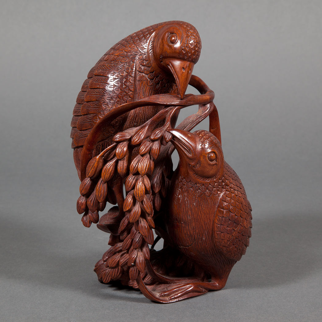 Appraisal: Chinese Boxwood Carving of Two Quail Each grasping a leafy