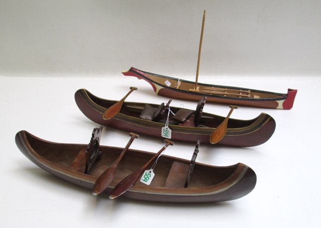 Appraisal: THREE ALASKAN SMALL WOOD MODEL BOATS complete with seat cushions