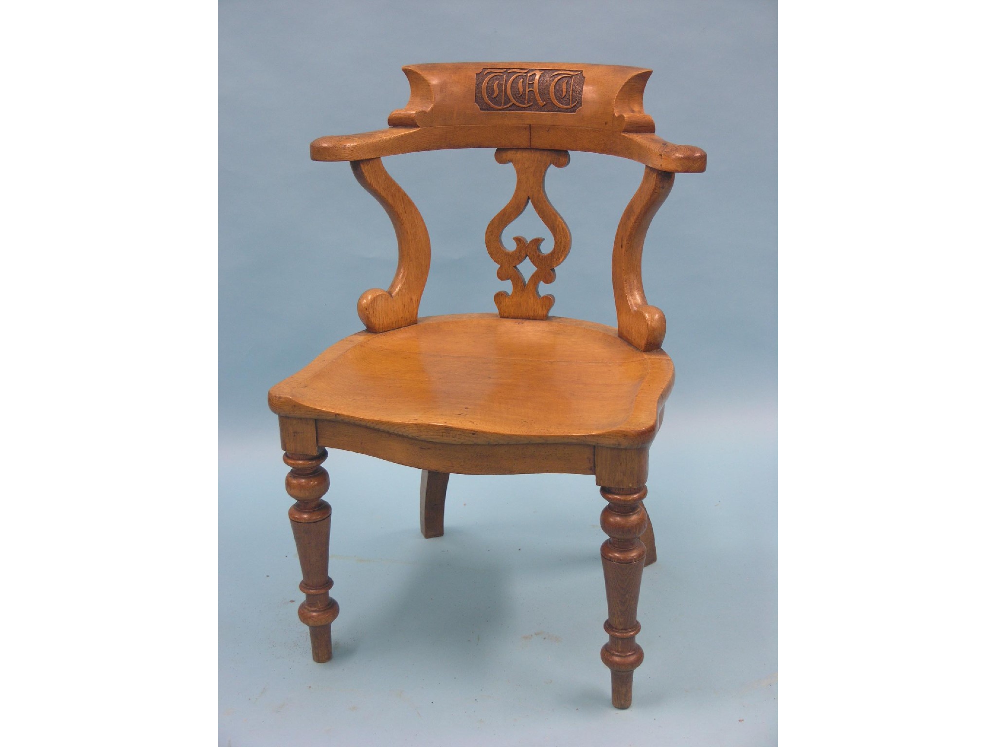 Appraisal: A Victorian light oak office chair bow-back with carved initials