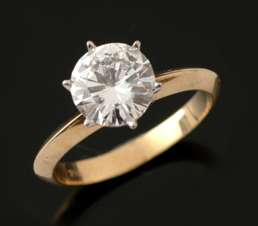 Appraisal: A diamond solitaire ring The round brilliant cut diamond weighing