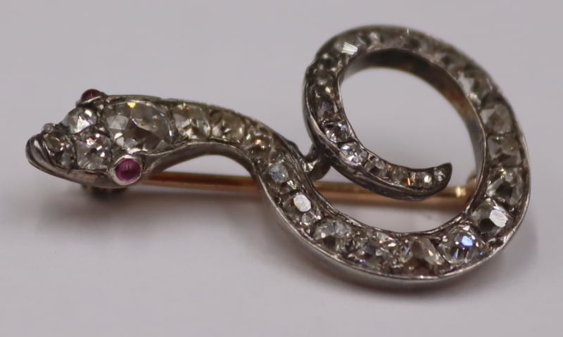 Appraisal: JEWELRY SILVER-TOPPED KT GOLD AND DIAMOND Snake Pin Antique Silver-topped