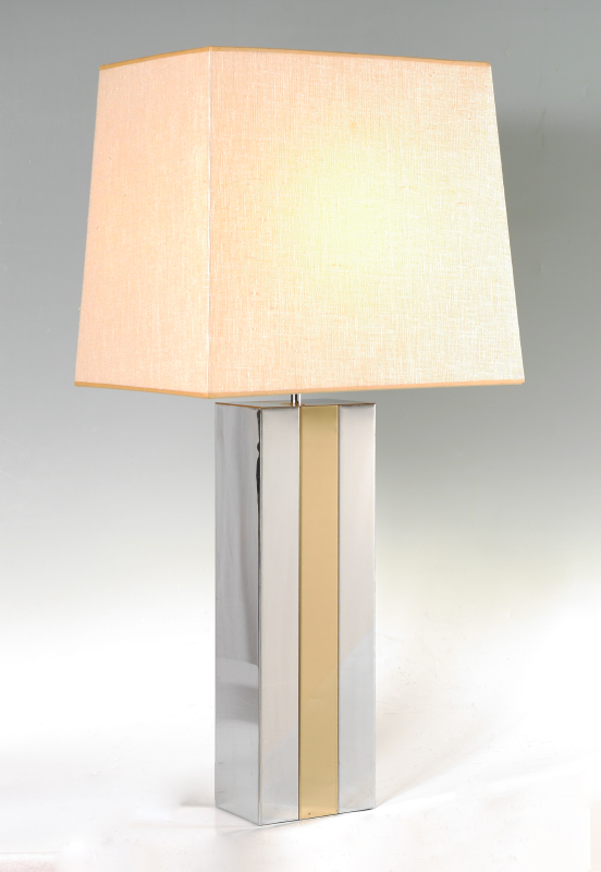 Appraisal: MODERNE CHROME BRASS TABLE LAMP Chrome steel body brass center