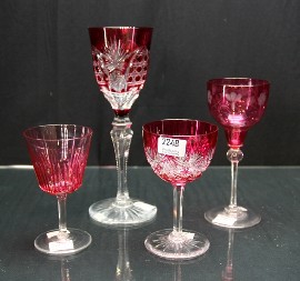 Appraisal: Four ruby flashed bowled wine glasses of various sizes and