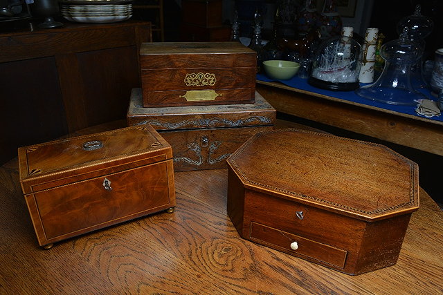 Appraisal: A th Century rosewood workboxwith fitted interior having sunk brass