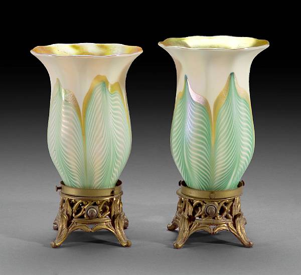 Appraisal: A near pair of Quezal pulled feather decorated glass shades