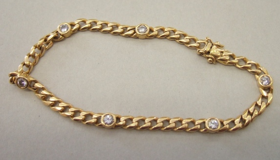 Appraisal: An ct gold and diamond set curb link bracelet collet