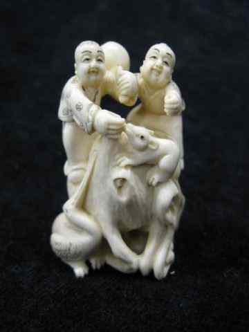 Appraisal: Carved Ivory Netsuke of Two Boys Animals signed ''