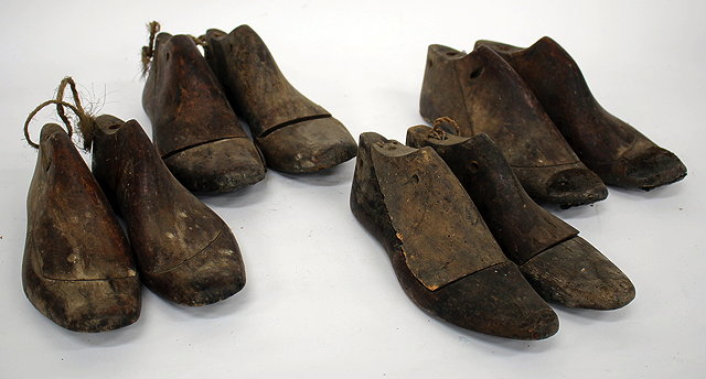 Appraisal: FOUR PAIRS OF CARVED WOODEN SHOE LASTS the largest approximately