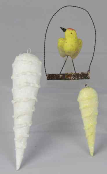 Appraisal: TWO PRESSED COTTON ICICLES CANARY ORNAMENT Germany two pressed cotton