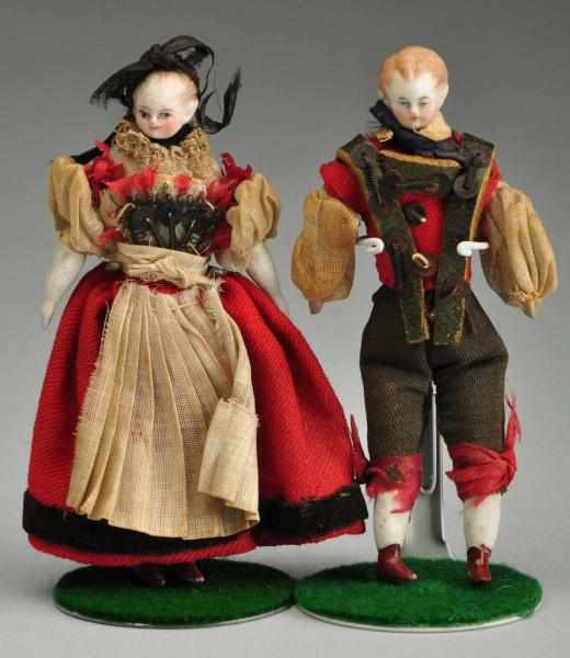 Appraisal: Pair of Parian Doll House Dolls Description Parian shoulder heads