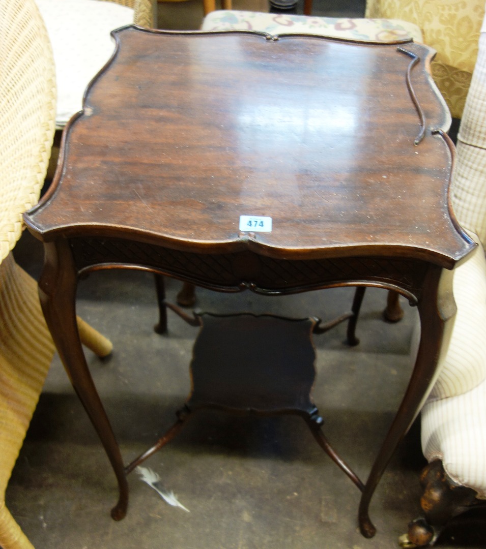 Appraisal: An Edwardian mahogany two tier centre table cm wide together