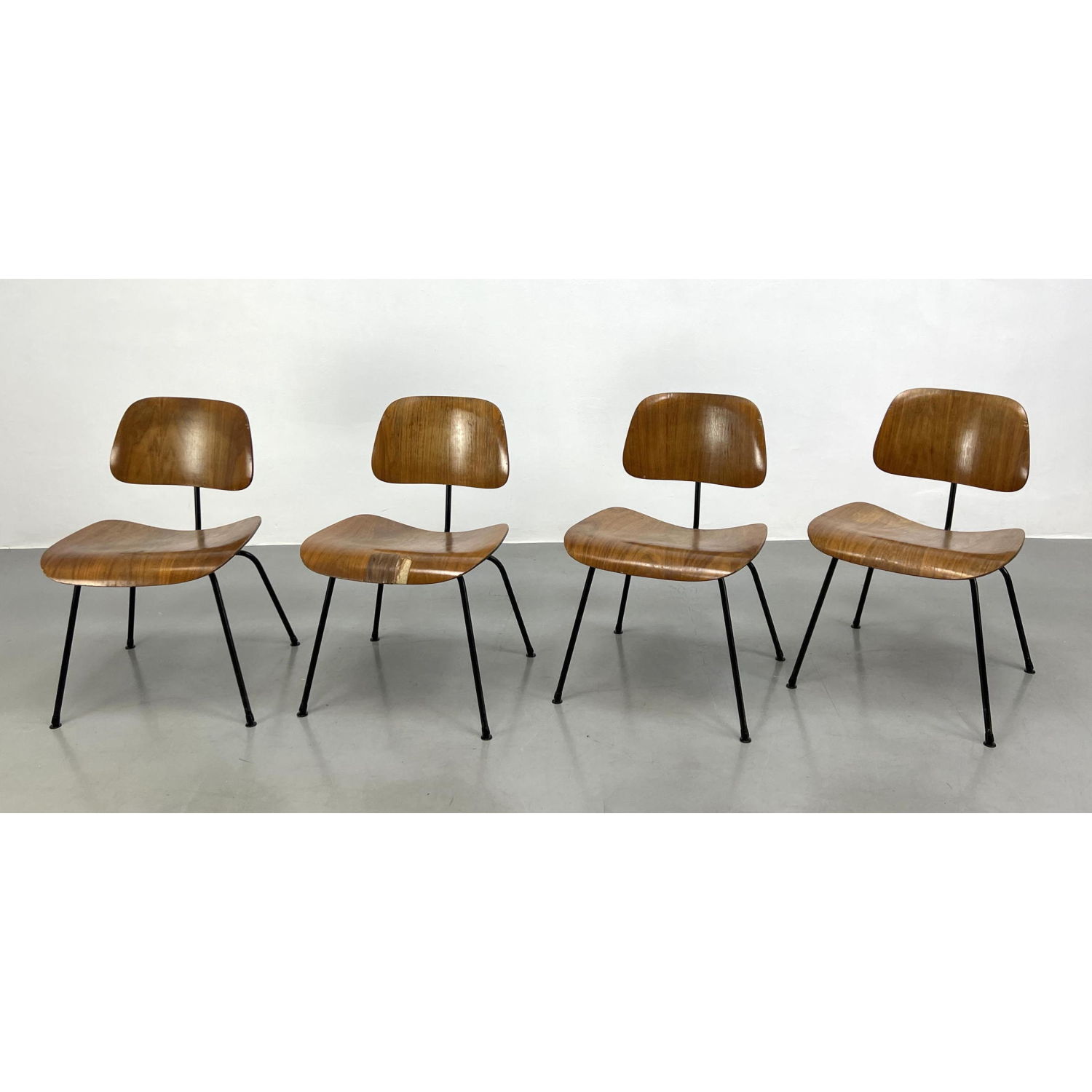 Appraisal: Set Charles Eames LCM Lounge Chairs Black Iron Legs Wood