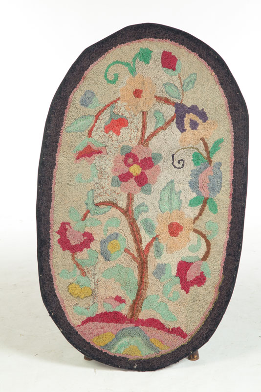 Appraisal: HOOKED RUG American early th century Oval multicolored floral design