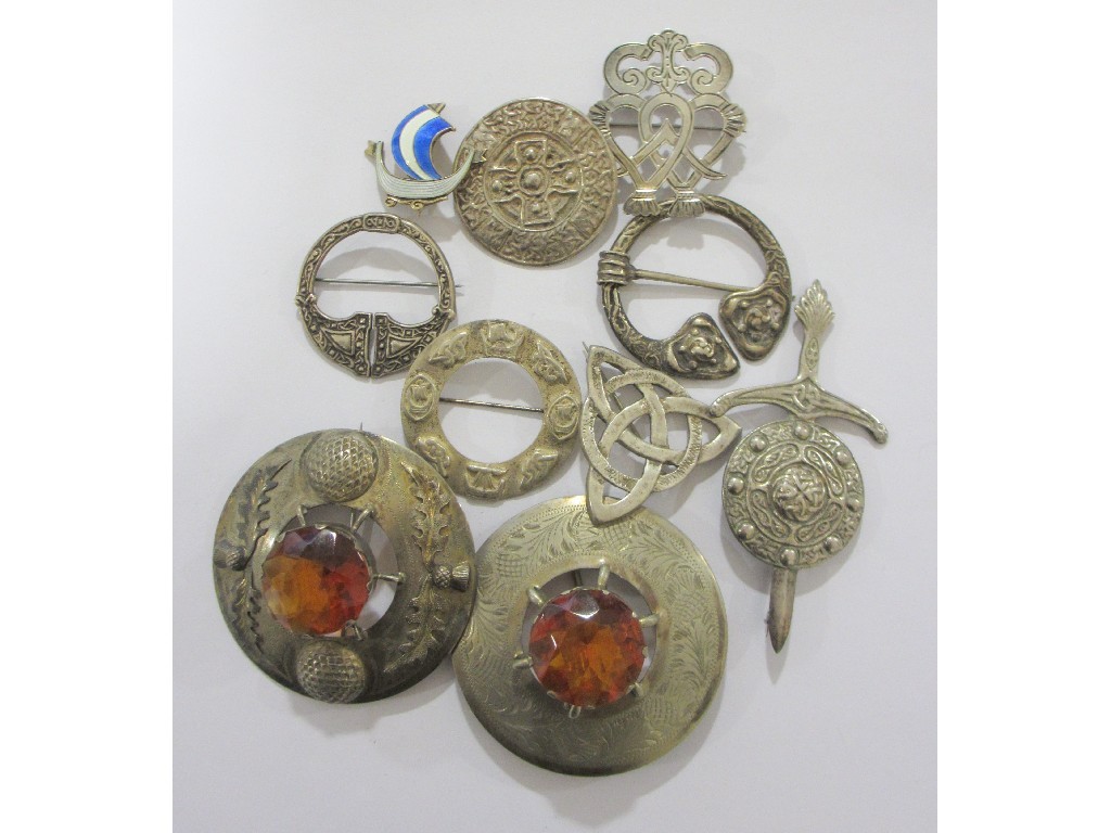 Appraisal: A collection of Scottish brooches to include two white metal