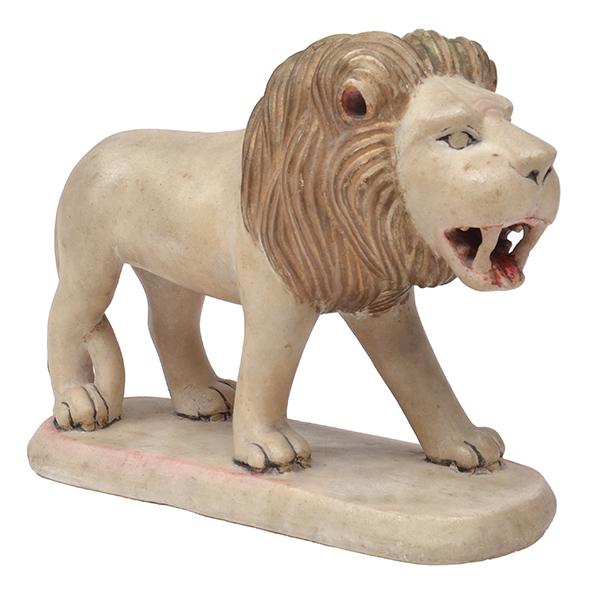 Appraisal: A SMALL PAINTED MARBLE FIGURE OF A LION with an