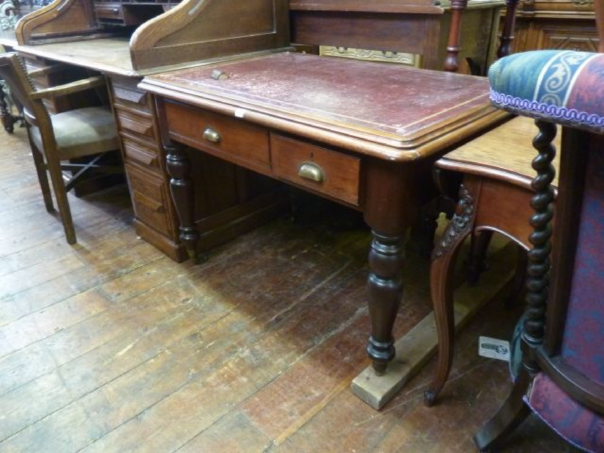 Appraisal: A Victorian mahogany writing table with inset maroon leather top