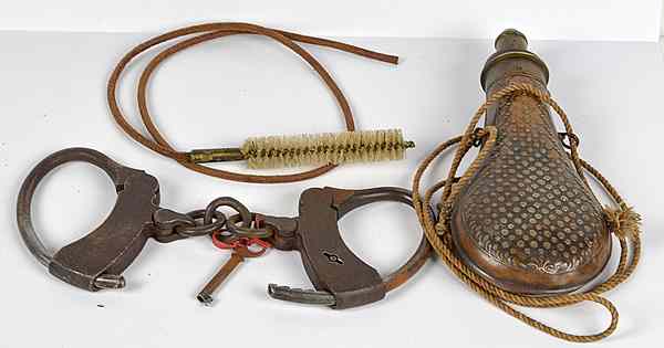 Appraisal: Copper Powder Flask Handcuffs and Key and Cleaning Brush ''