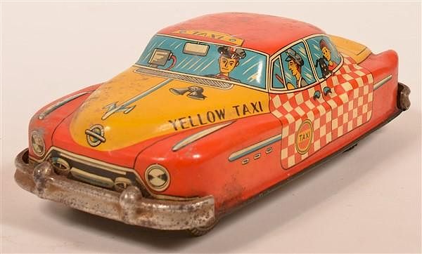 Appraisal: Yellow Taxi Tin Lithograph Friction Toy Yellow Taxi Tin Lithograph