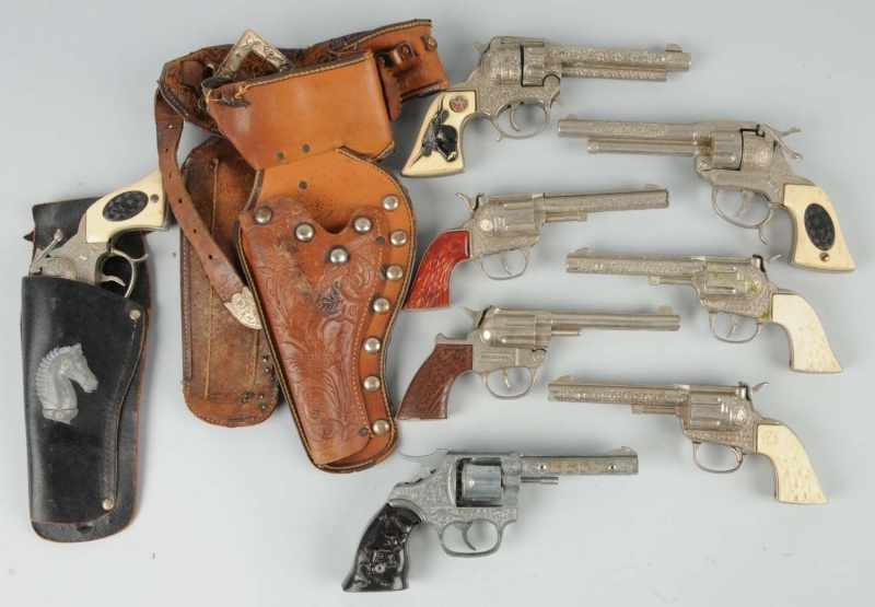 Appraisal: Lot of Die-Cast Cap Pistol Toys Description Includes two holsters