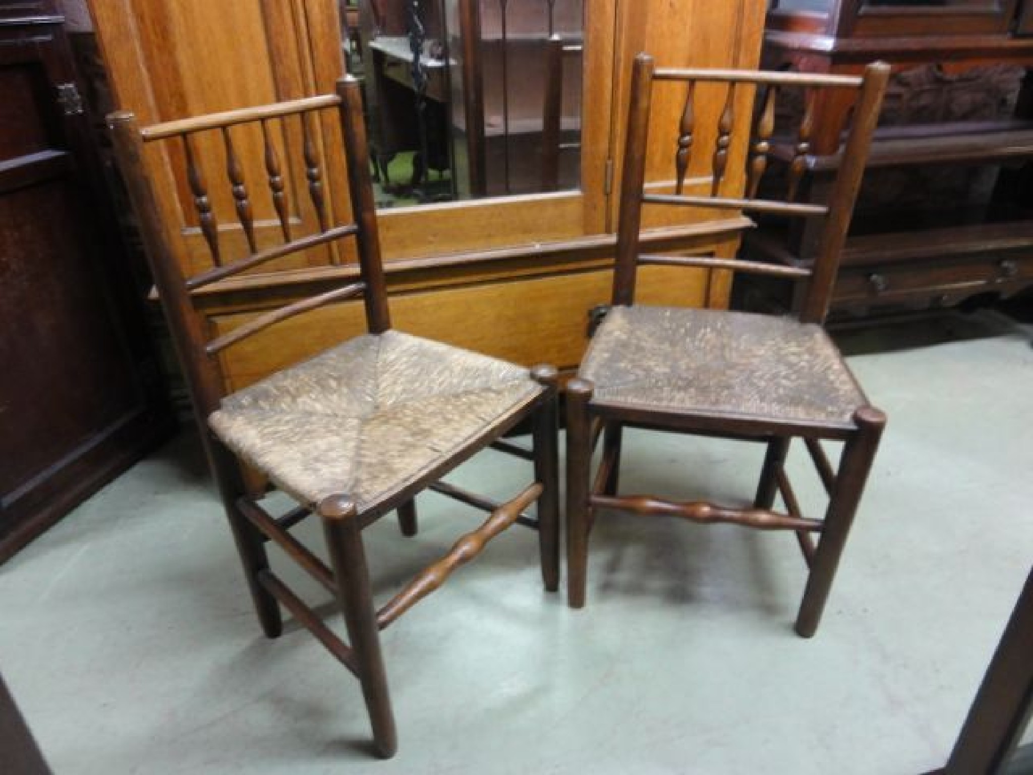 Appraisal: A pair of Georgian ash cottage spindleback dining chairs with