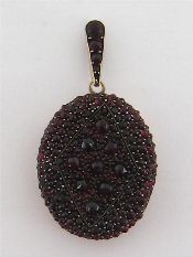 Appraisal: A th century Bohemian garnet locket pendant the oval locket