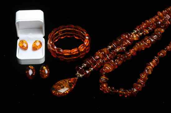 Appraisal: FIVE PIECES AMBER JEWELRY Polished chunk necklace L in polished