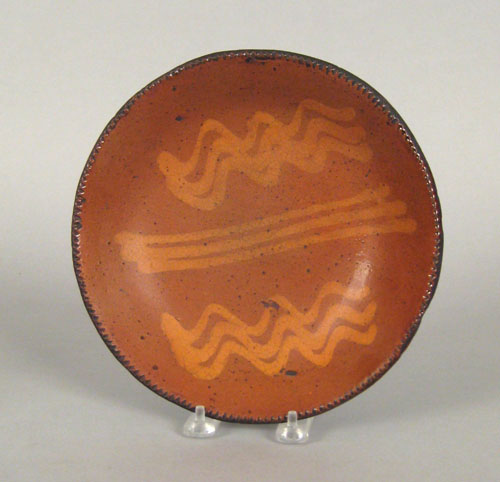 Appraisal: Pennsylvania redware pie plate th c with slip decoration dia