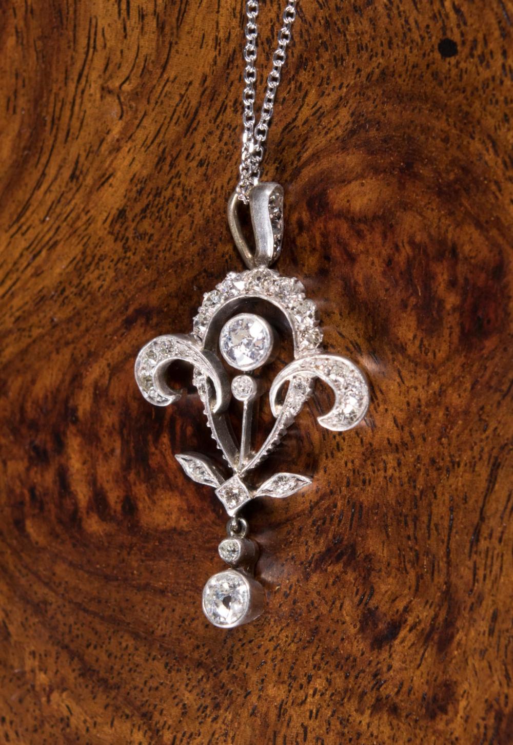 Appraisal: DIAMOND AND FOURTEEN KARAT WHITE GOLD PENDANT NECKLACE with an