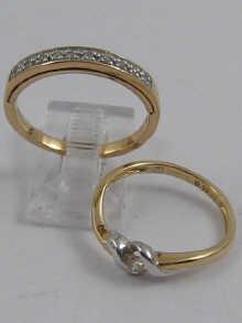 Appraisal: A carat gold diamond solitaire ring together with a carat