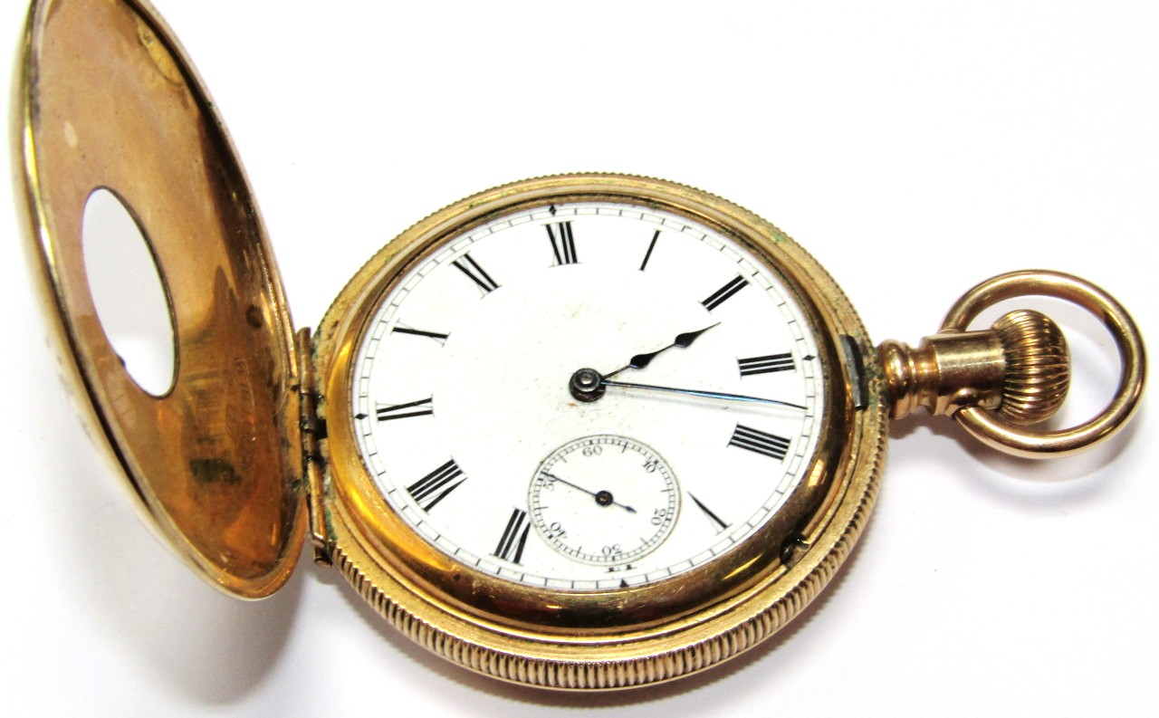 Appraisal: An early thC half hunter pocket watch the cm dia