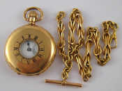 Appraisal: A gold plated half hunter pocket watch on a carat