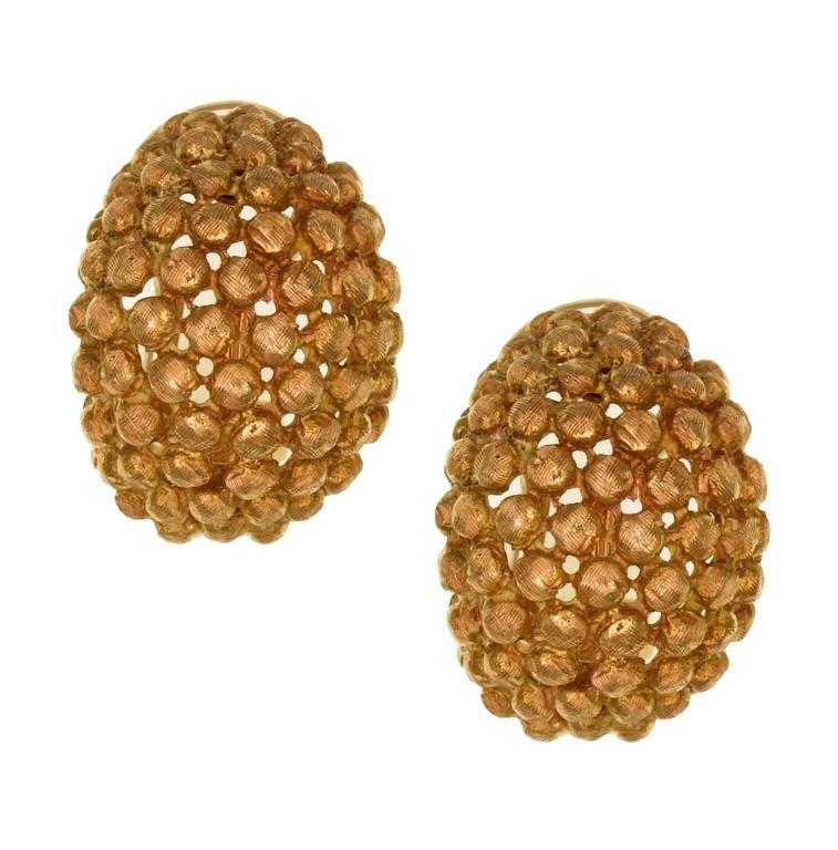 Appraisal: A PAIR OF GOLD EARRINGS of textured bean form clip